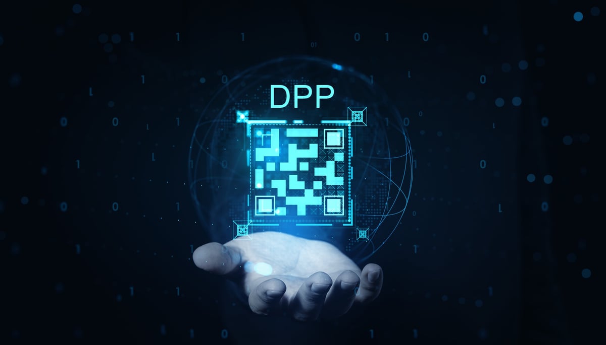 Glowing digital product code above an open hand on a dark background